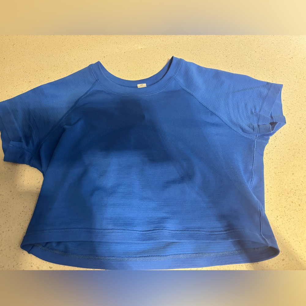 short sleeve cropped swiftly tech, pipe dream blue, size 4. worn once, like new